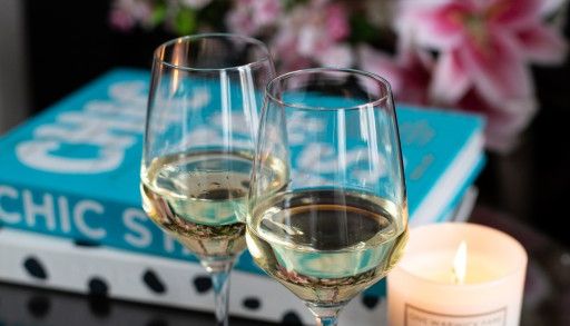 Glasses of wine on a decorated table